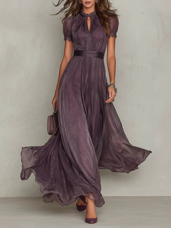 Women's purple maxi dress with a lace keyhole neckline and flowing skirt.