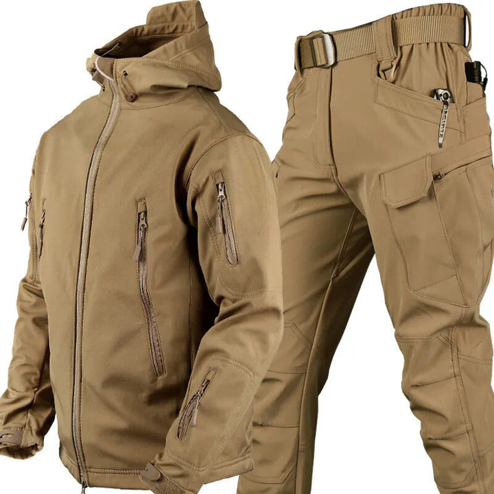 Tan hooded jacket and matching cargo pants with belt displayed together, showing zippered pockets and a flap thigh pocket. 15