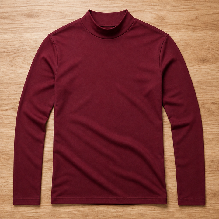 Burgundy long sleeve tee with a high neck collar laid flat on a wood surface, front view.